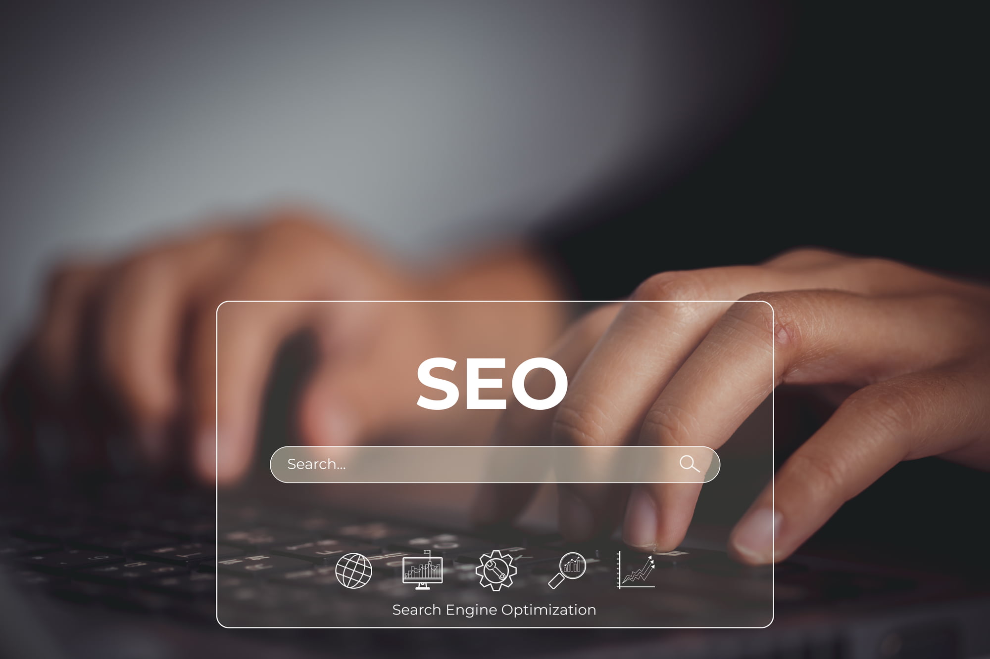 SEO concept with search engine optimization elements over a laptop