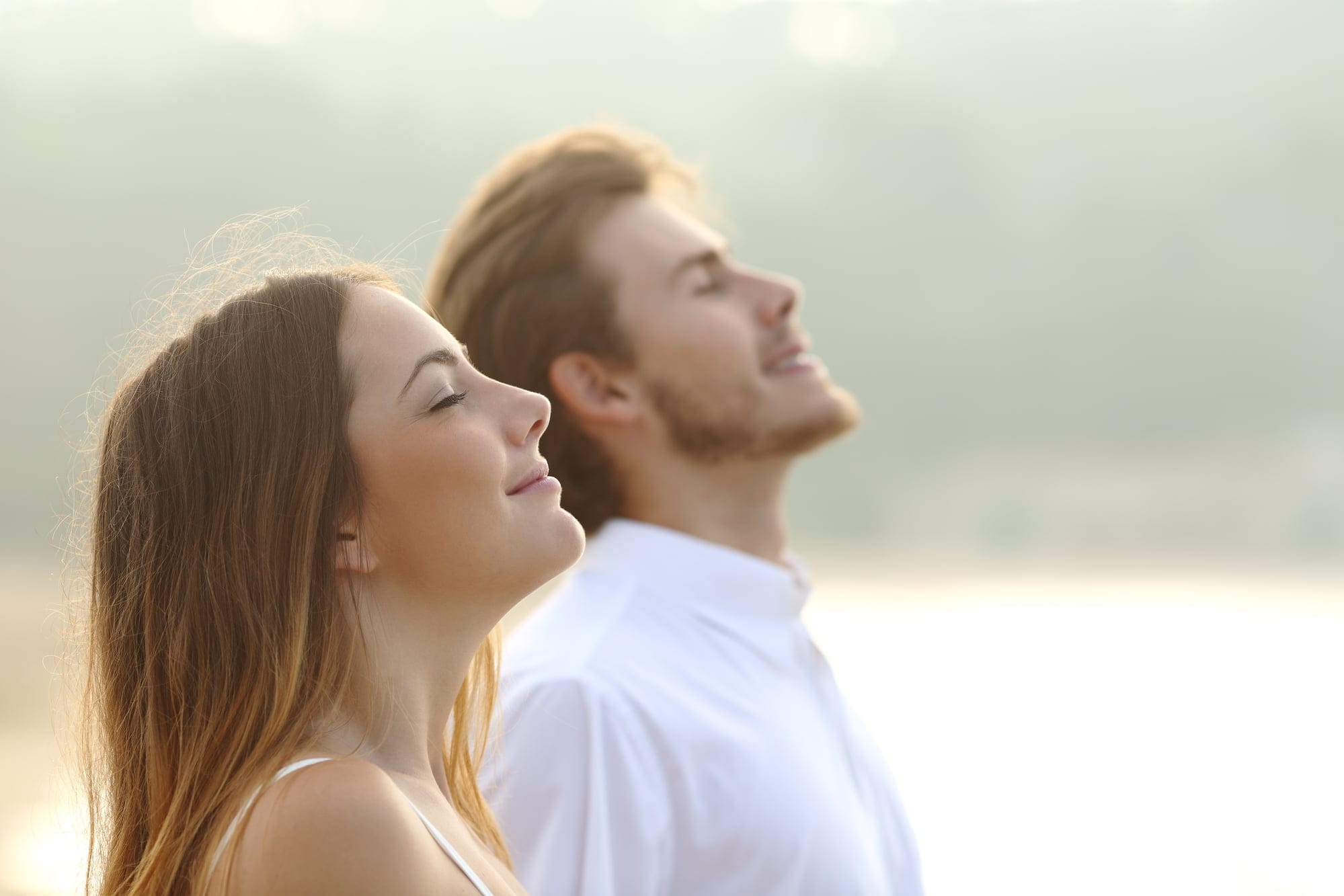 Couple breathing fresh air outdoors, a personal development practice