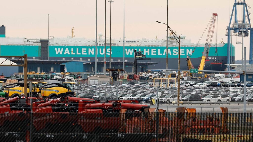 New American construction equipment and Japanese cars fill holding lots at the Port of Baltimore on March 28, 2024 in Baltimore, Maryland. 