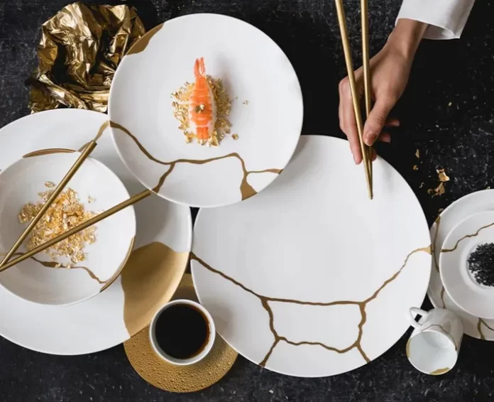 Kintsugi, the Japanese art of repairing broken pottery by joining pieces back together and filling cracks with lacquer dusted with powdered gold, silver, or platinum.