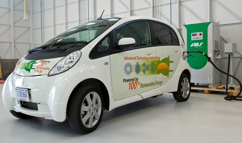 A plug-in electric vehicle connected to a charging station at the U.S. Department of Energy Vehicle Testing and Integration Facility.