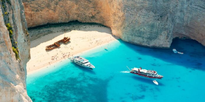 A shipwreck sits stoically on this stunning beach located on the northwest coast of Zakynthos.