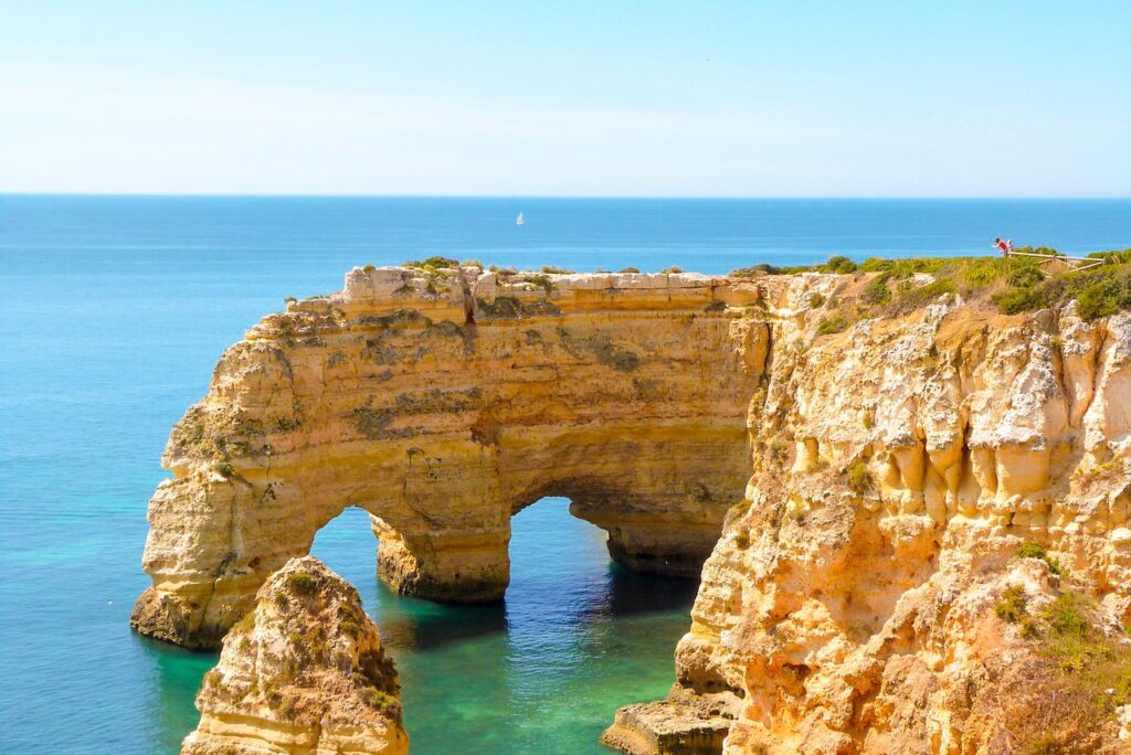 Praia da Marinha is one of the most beautiful beaches in Portugal and all of Europe. It is located in the central Algarve near the towns of Lagoa and Carvoeiro and is known for its stunning cliff formations, golden sand, and clear blue water.