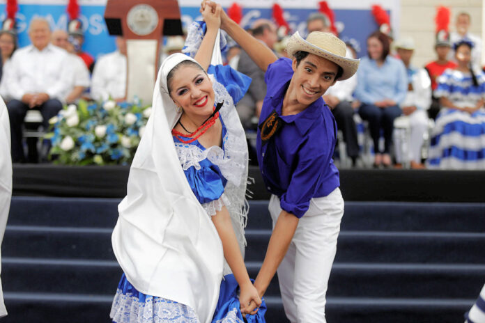 Traditional Salvadoran folk costumes worn during a cultural celebration