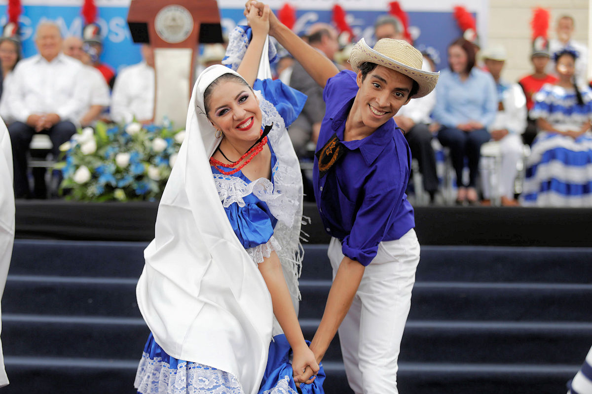 Traditional Salvadoran folk costumes worn during a cultural celebration